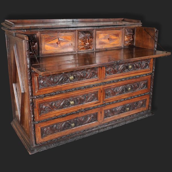 An Italian carved walnut wood chest of drawers with four drawers, Lombardy, 17th century