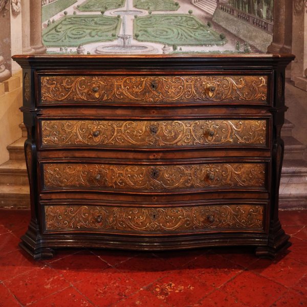 A North Italian walnut and gilded pastiglia chest of drawers, Milan, 17th century