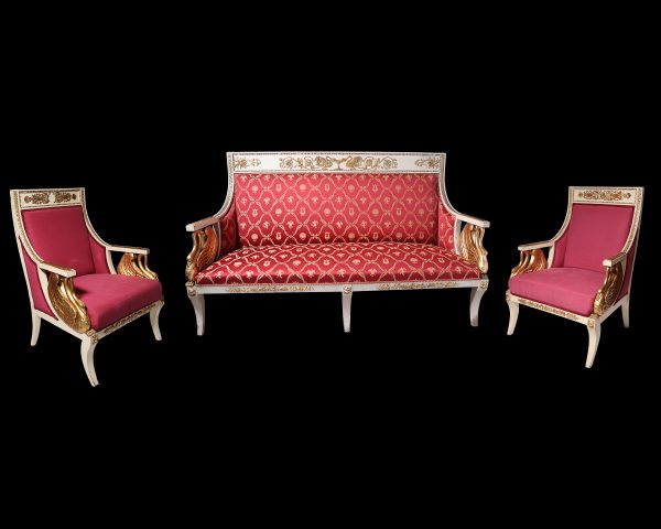 An Italian sofa with two lacquered and gilded armchairs, 19th century