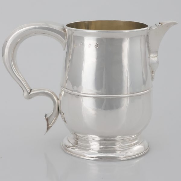 A Queen Anne Britannia silver pitcher, James Rood, London, 1711